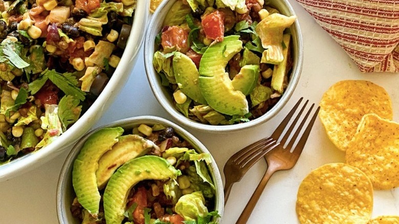 Small bowls of taco salad and tortilla chips