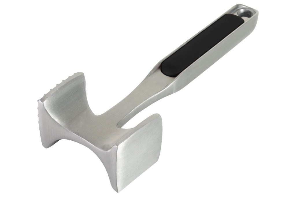 A metal hammer with a black handle used for tenderizing meat