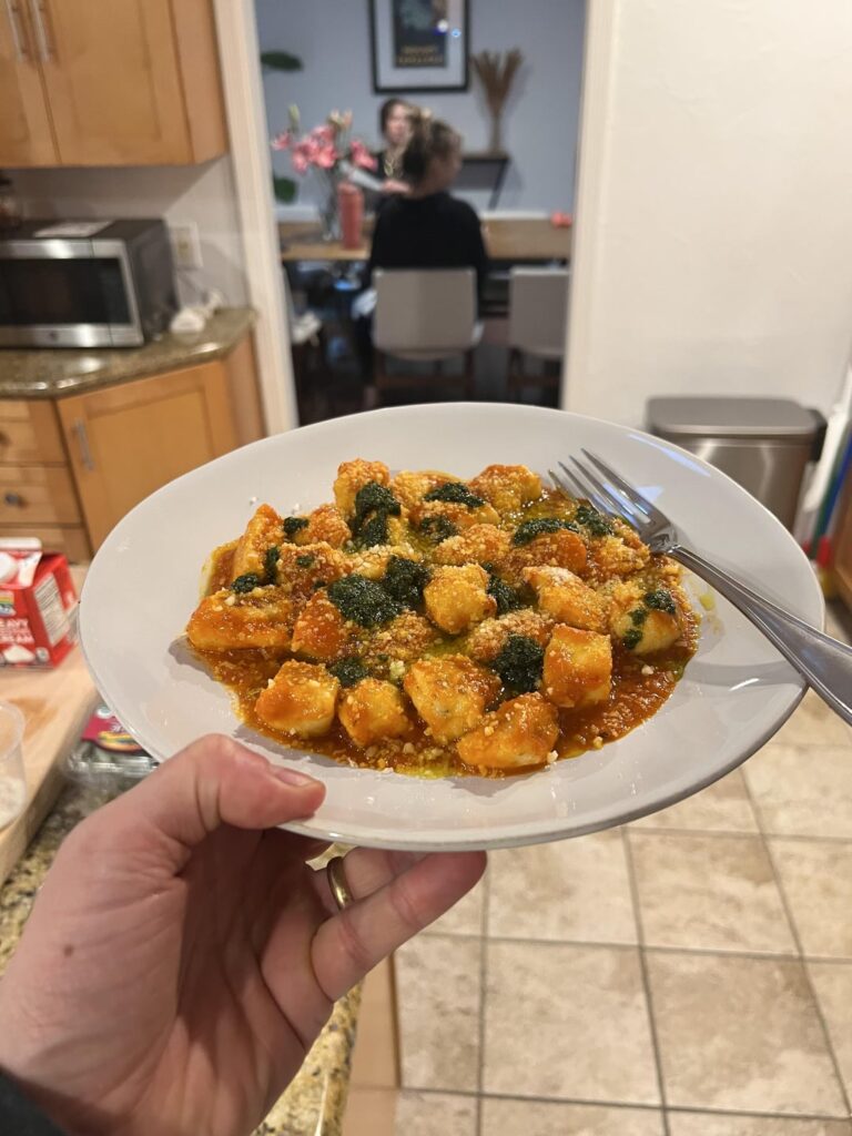 Teaching my daughter - Ricotta gnocchis, last summers yellow tomato sauce, basil pesto.