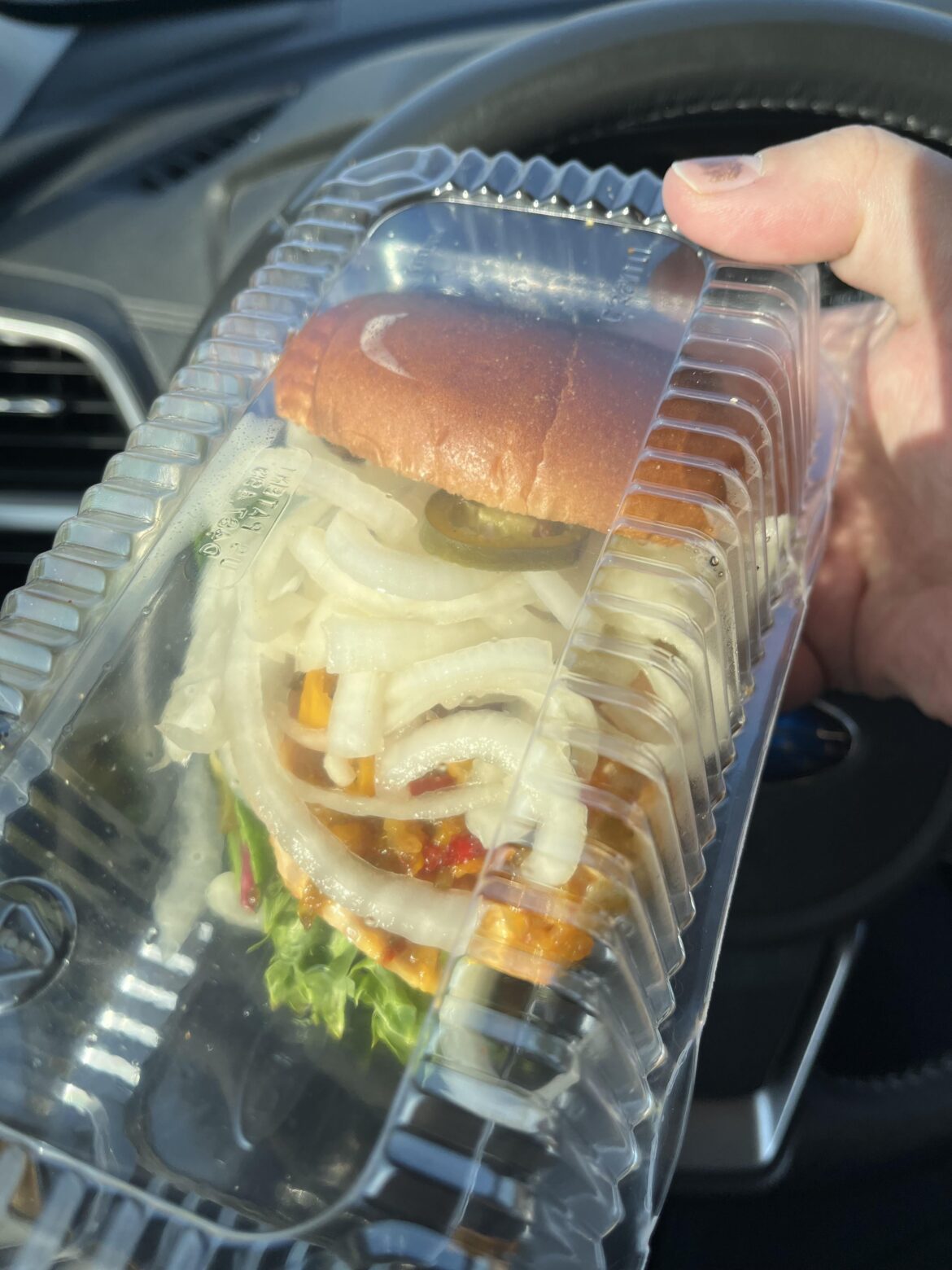 This chicken sandwich is inundated with pickled onions