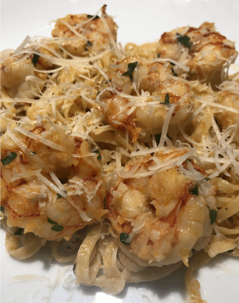 Shrimp scampi over linguine