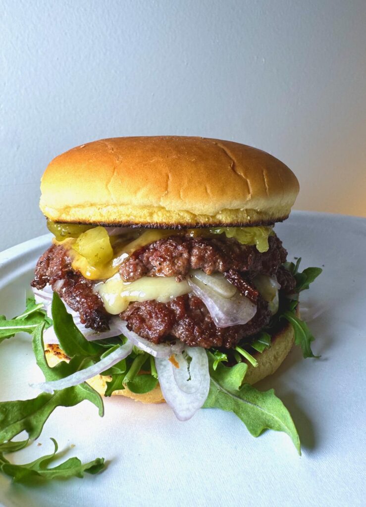 Double smash—pepper jack, smoked cheddar, Hatch chiles, shallots, and Kewpie burger sauce.