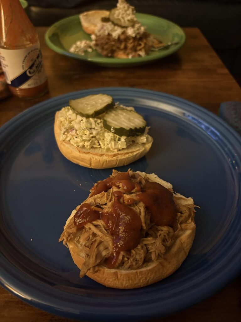 i think i committed a bbq crime. Carolina style pulled pork with Kansas City ish bbq sauce, slaw, and pickles.