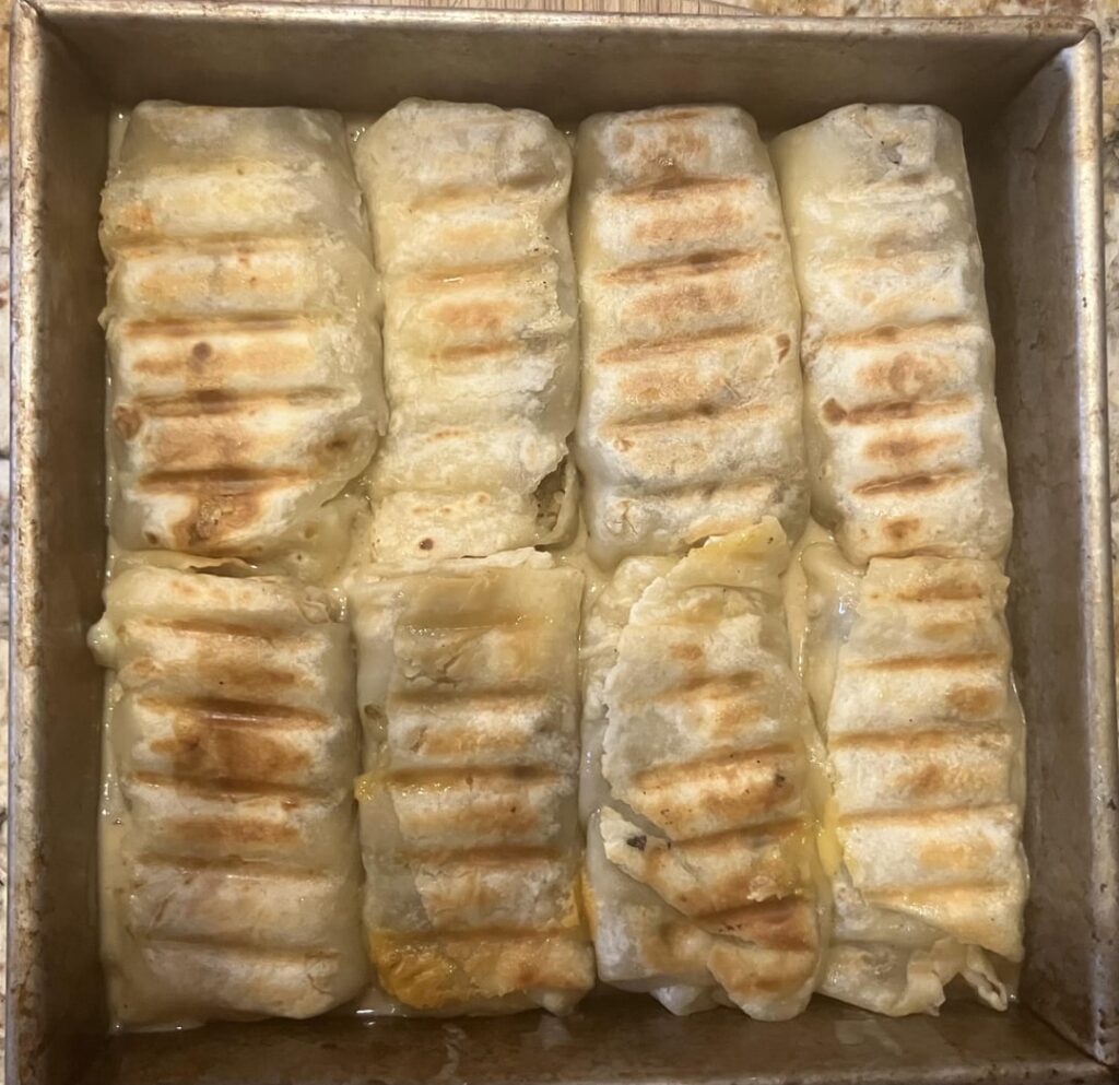 Grilled & smothered leftovers burritos.