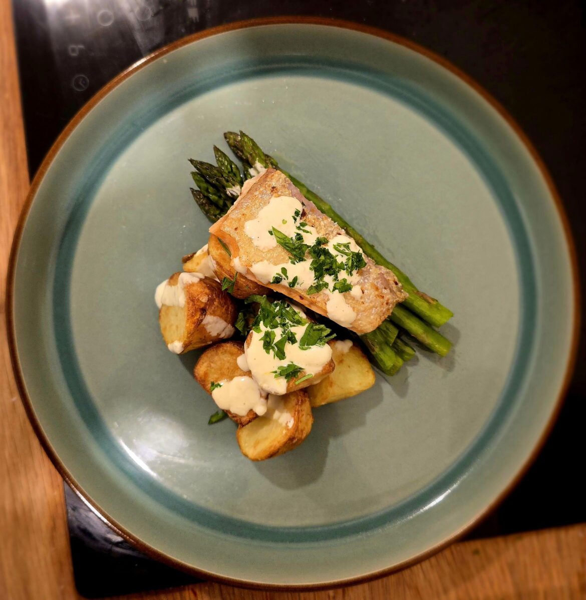 Pan seared salmon, new potatoes, asparagus and a white wine sauce