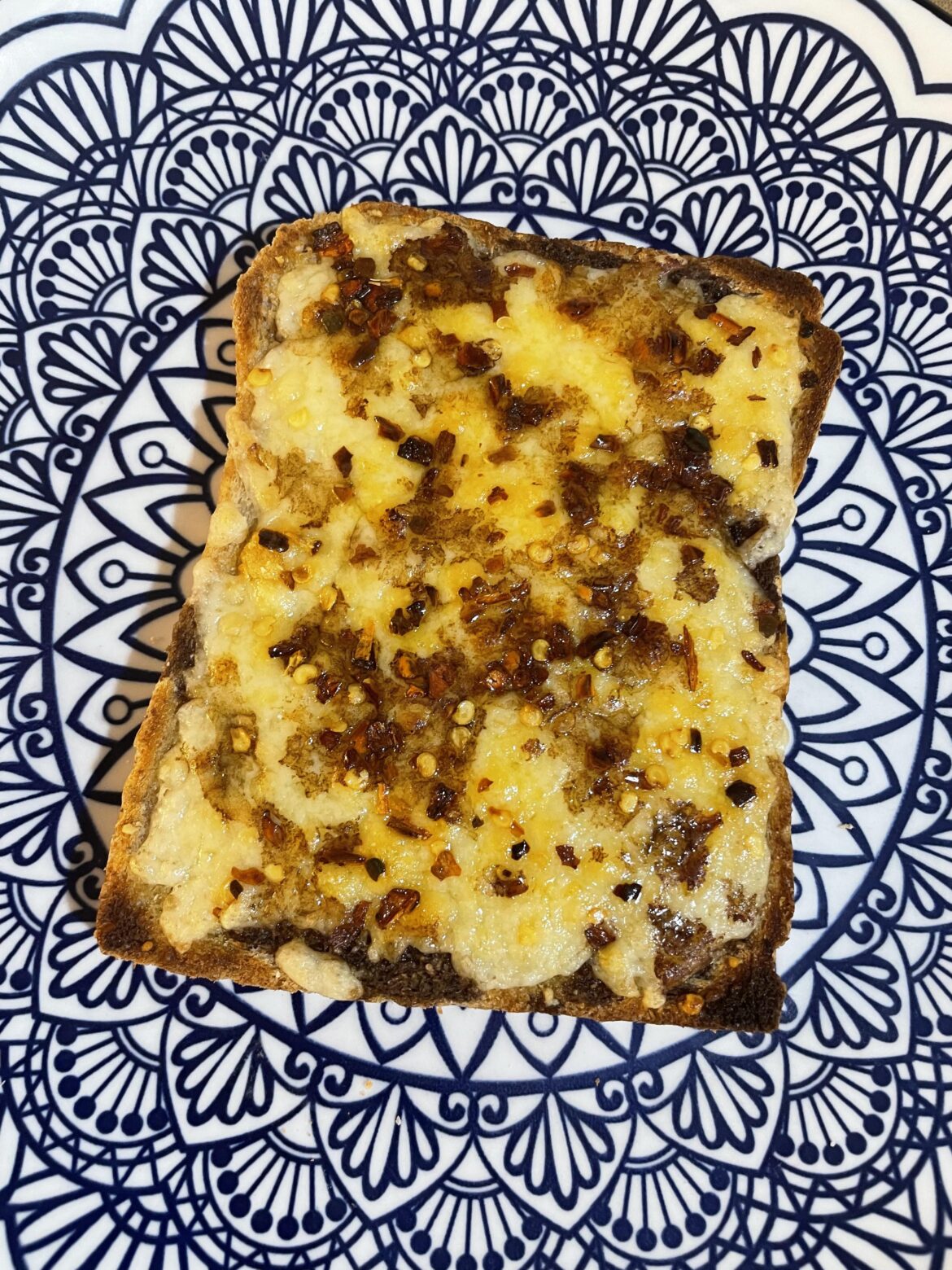 Cheese on toast with chilli flakes and Henderson’s Relish