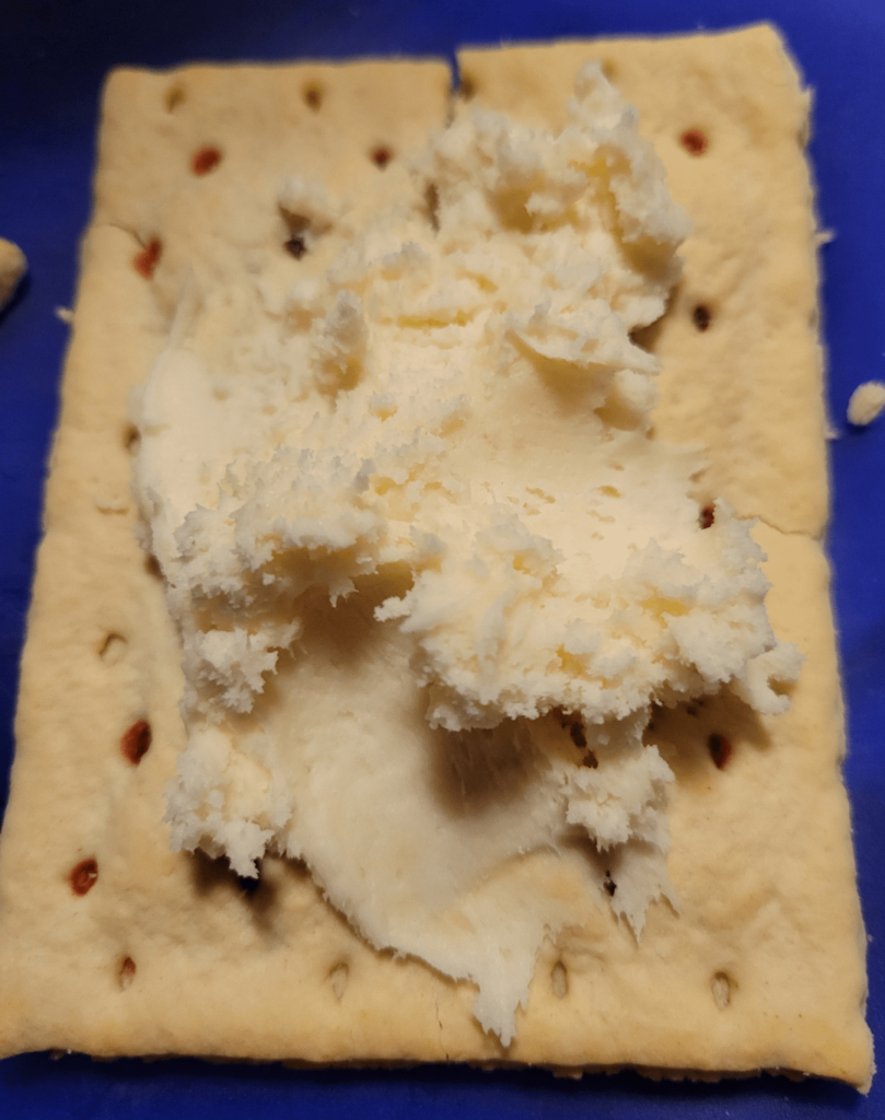 I am eating actual whipped cream cheese frosting on a strawberry pop-tart. Someone scammed me and still my debit card number. I'm stressed.