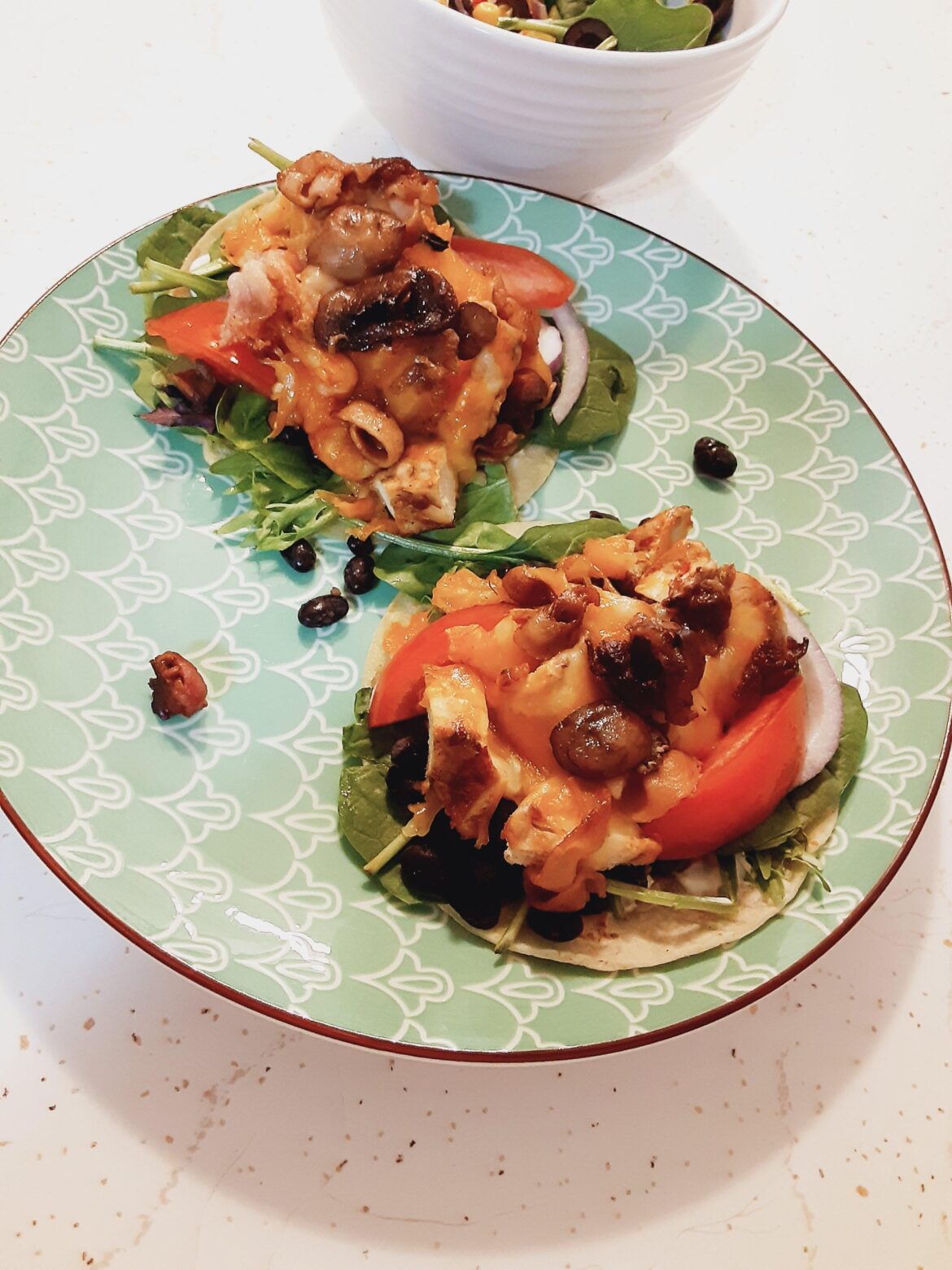 Just a couple soft tacos. Grilled chicken and everything but the kitchen sink added in