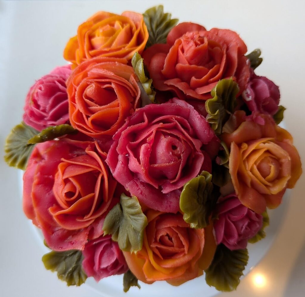 First time piping buttercream roses for birthday cake