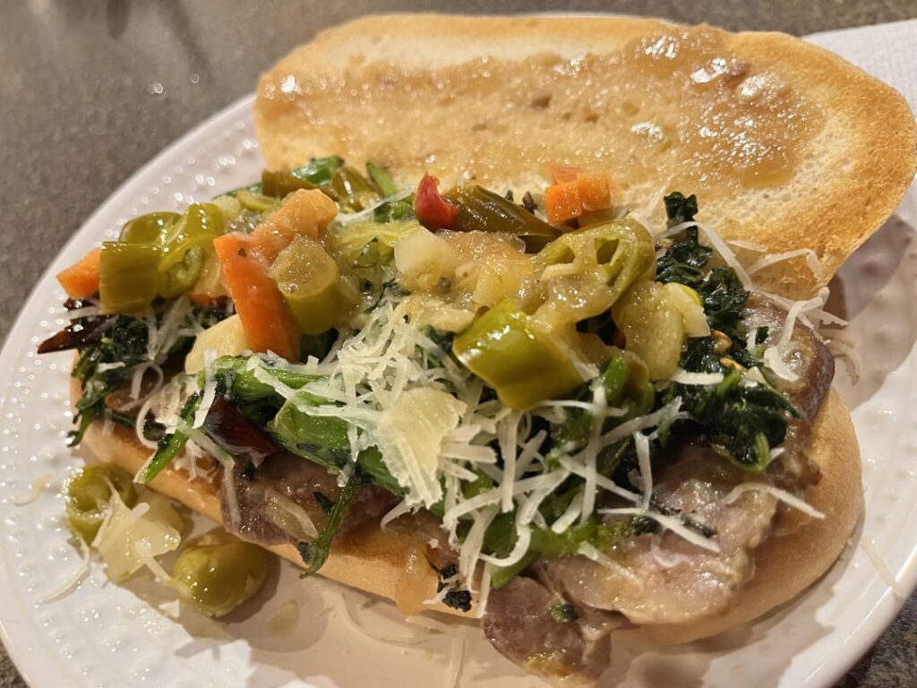 Philly style roast pork sandwich, broccoli rabe, sharp provolone and giardiniera instead of roasted long hots