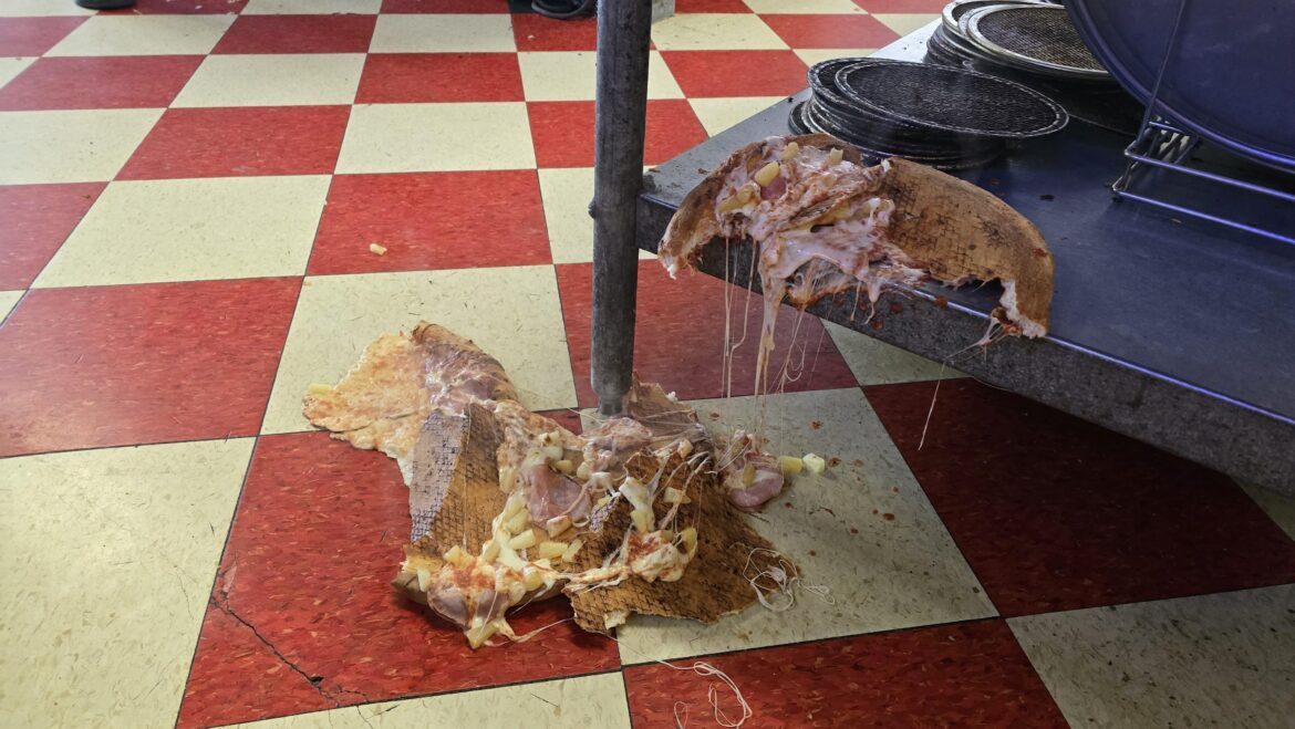 There was a hole in bottom of this pizza, and it's spontaneously collapsed. Marking NSFW for the toppings.