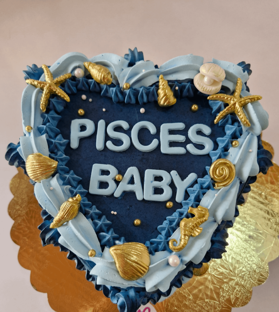 Traditional cake filled with dulce de leche, decorated with buttercream, Pisces baby.