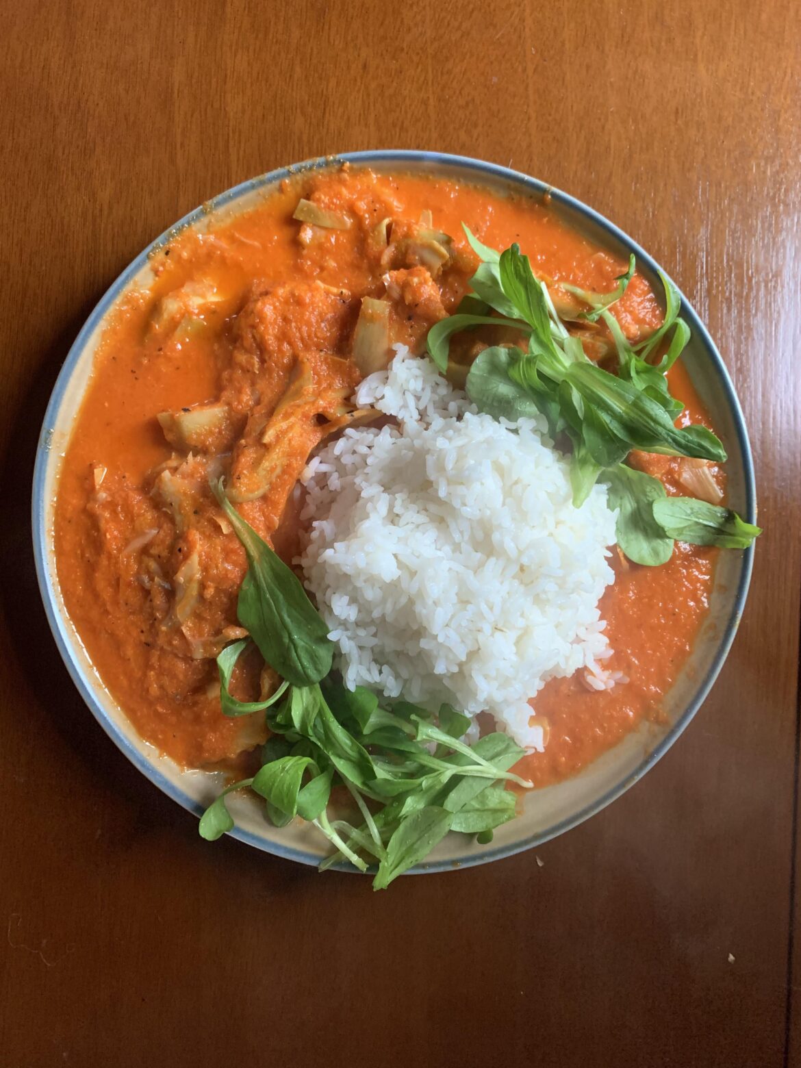 Roasted chicken stew with artichokes and red pepper sauce.  Lots of garlic. Mache.