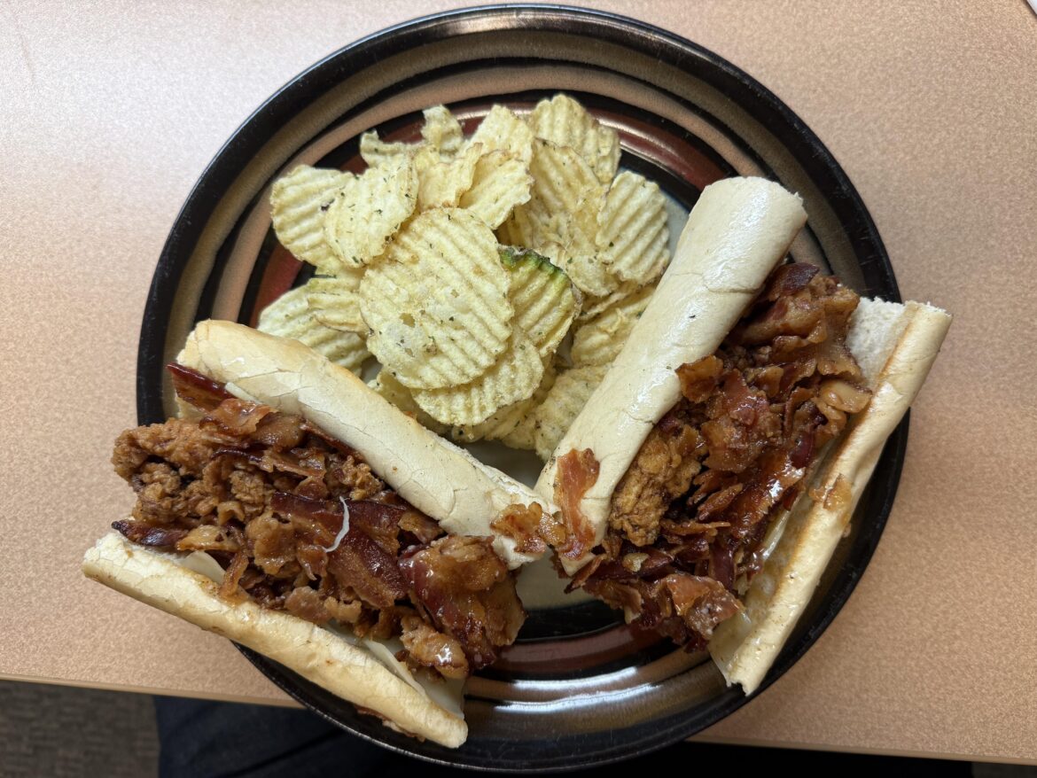 Fried chicken with bacon and cheese on a sub roll