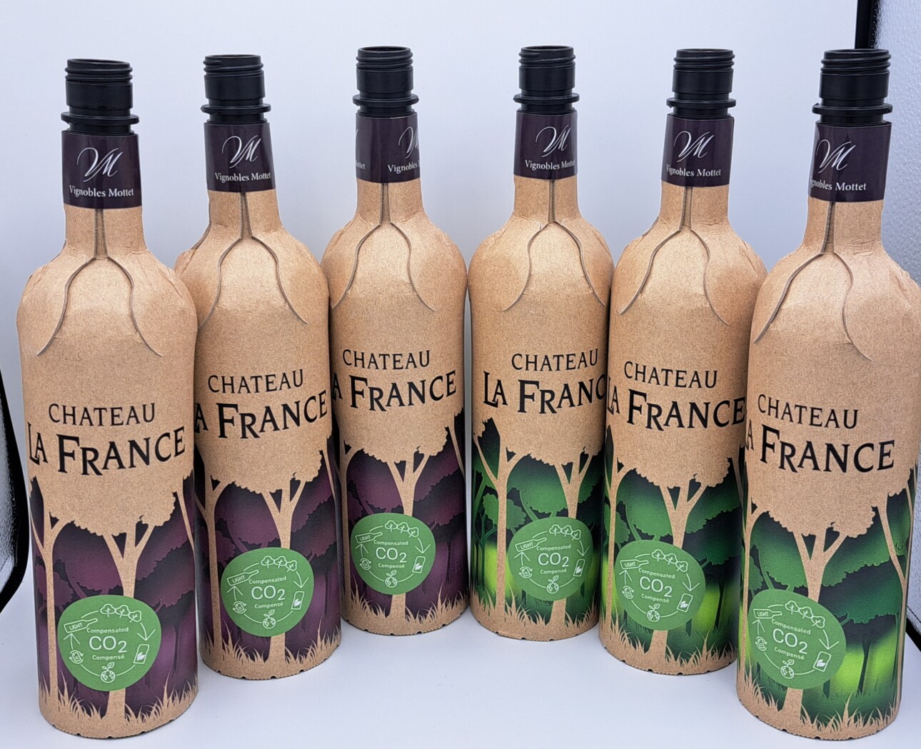Six cardboard wine bottles labeled Château La France.