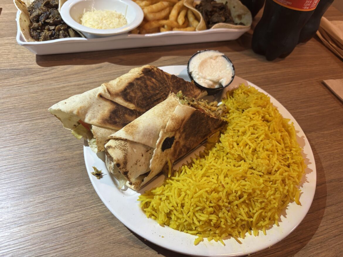 Chicken shawarma with orange rice on a pita 🥙
