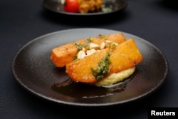 FILE - A recipe created by Charles Guilloy, the executive chef for the Paris 2024 Olympic Games, that will be available at the athletes' village during the Paris 2024 Olympic and Paralympic Games, is displayed during a press presentation in Paris, France, April 30, 2024.