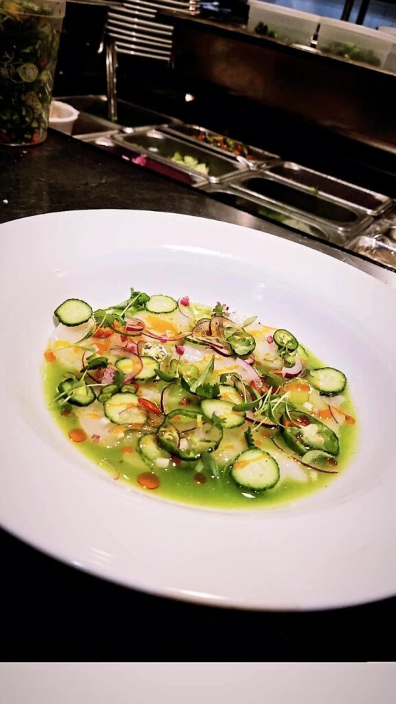 Scallop aguachile, Cucumber, serrano, red onion, radish, micro cilantro, red chile oil. Entree and tasting menu versions.