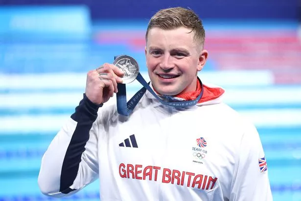 Adam Peaty of Team Great Britain poses following the Swimming medal ceremony
