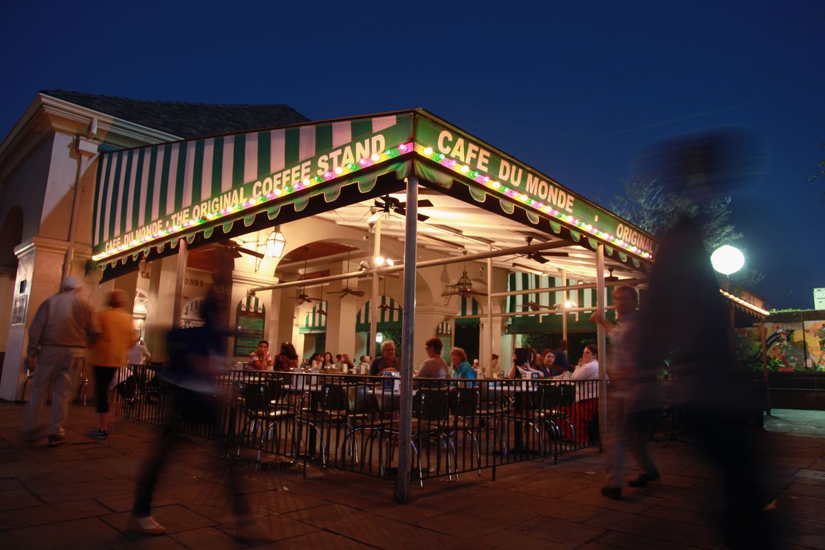 People walk by Cafe Du Monde restaurant in the French Quarter on January 28, 2013 in New Orleans, Louisiana.