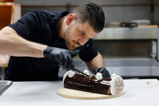 Pastry chef Clément Le Déoré of Desserts by Clément decorates...