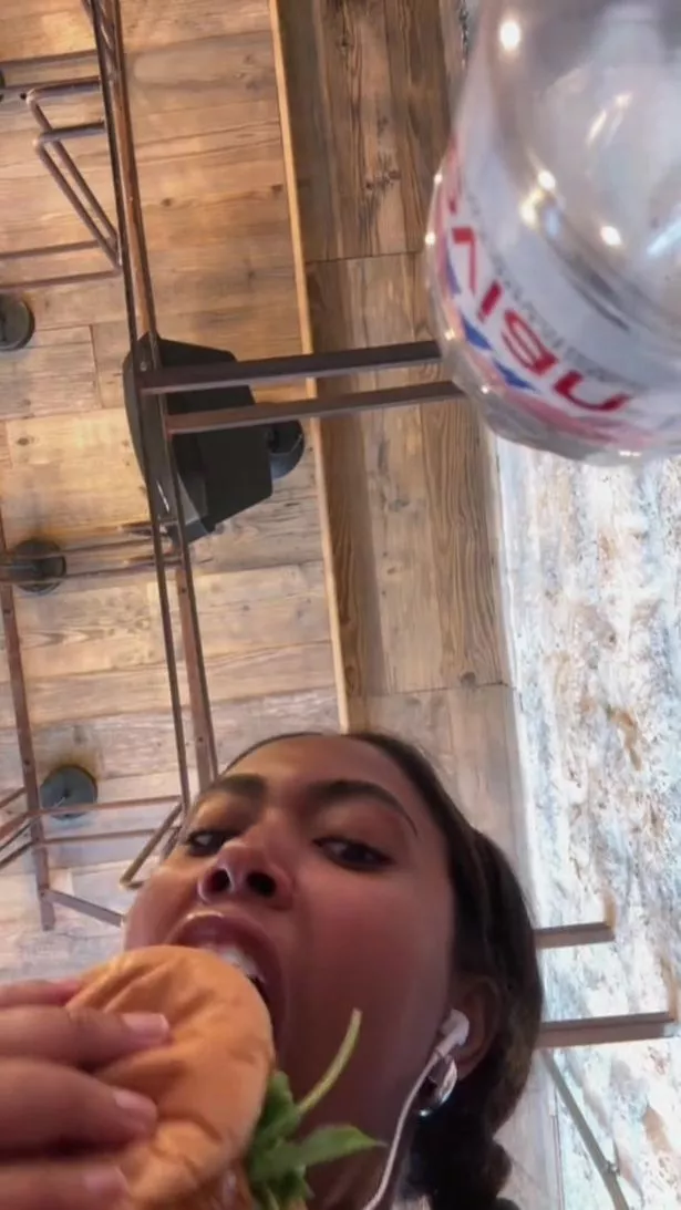 woman eating chicken sandwich