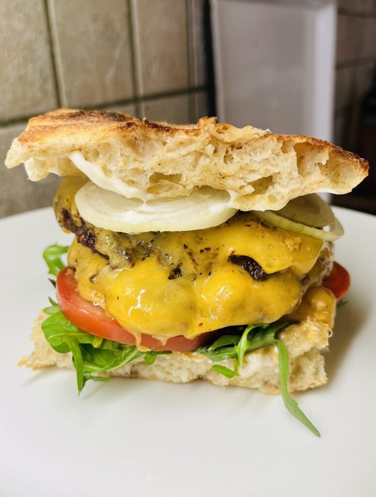 A double cheeseburger made with "pizza baciata" sourdough | The Fat Chamois