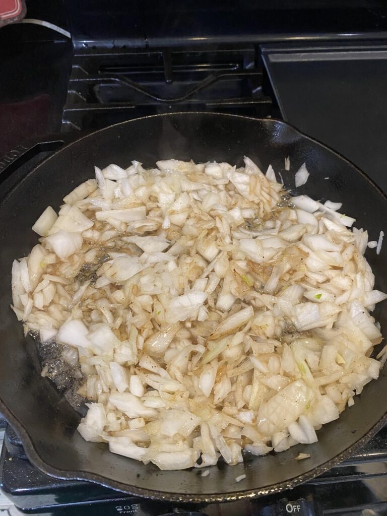 Roughly chopped onions cooked in bacon grease. All from one massive white onion