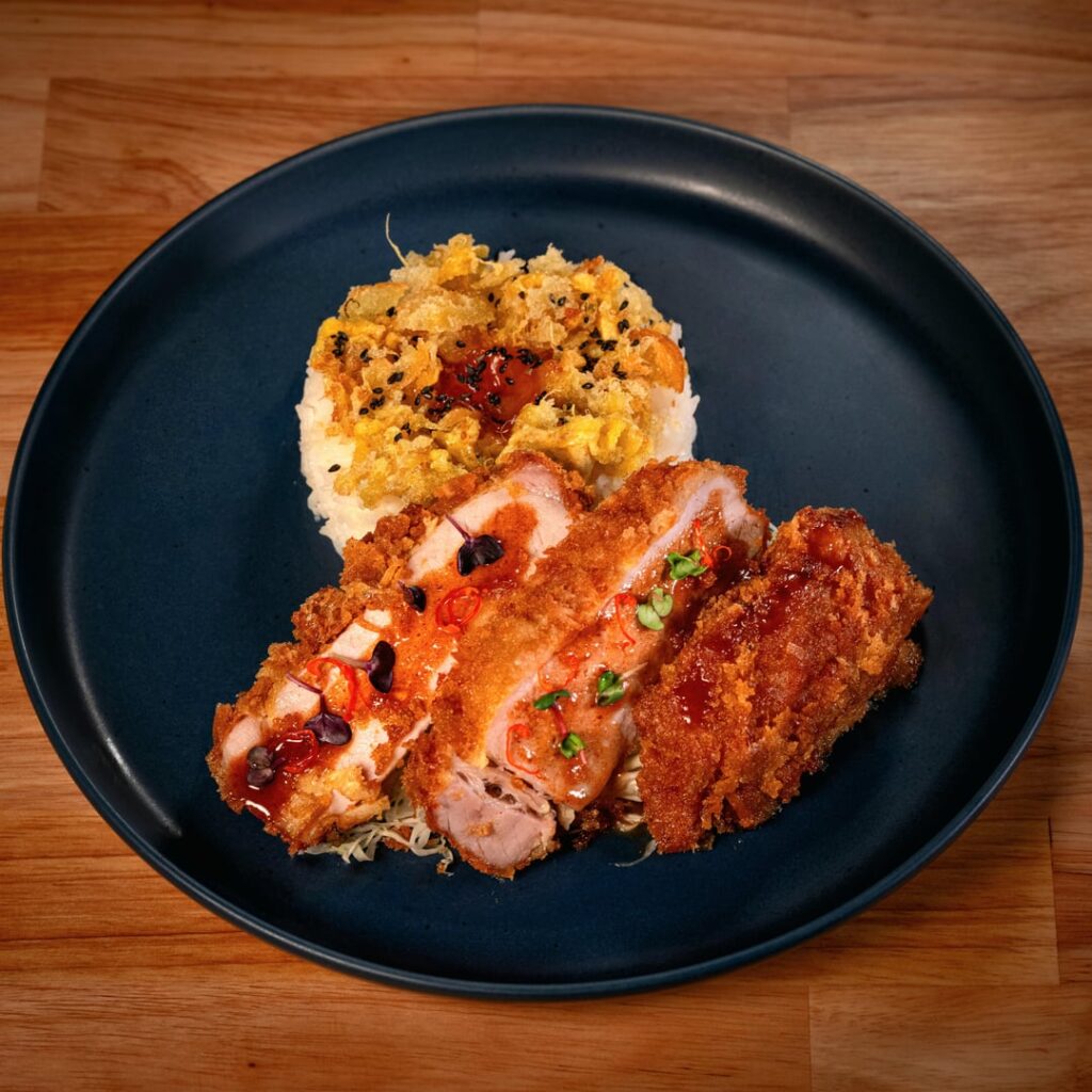 Tonkatsu with a date/ginger sauce. Tonkatsu with a date/ginger sauce.