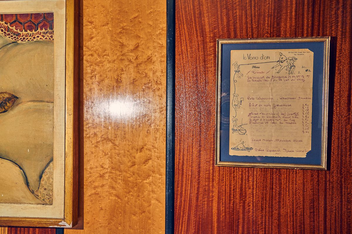 An old framed menu remains on the wall of the restaurant.