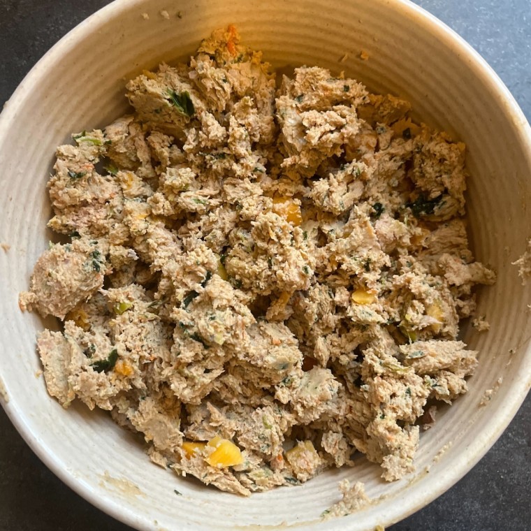 White bowl with fresh dog food