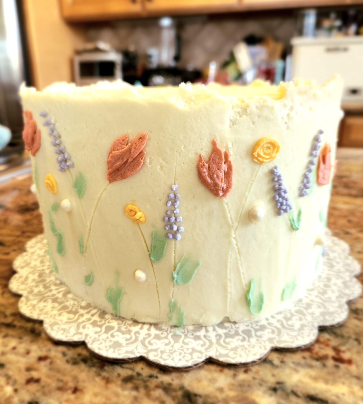 Springtime cake for a charity event! Vanilla cake, lemon curd filling, ermine frosting