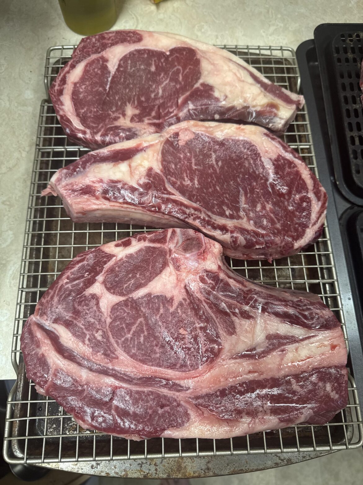 Ribeyes we purchased from a local farm - what’s the extra layer of meat on the largest ribeye???