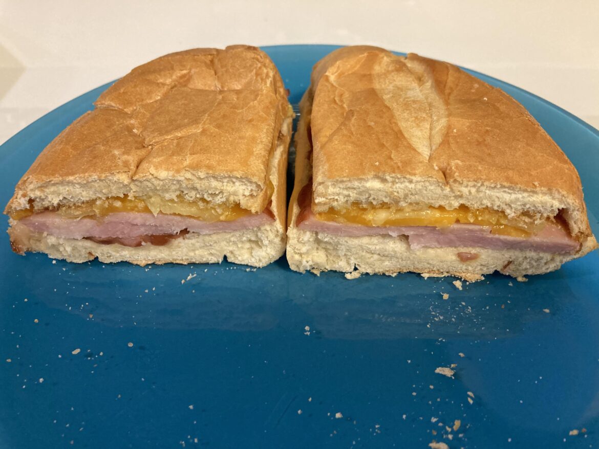 Hawaiian sandwich with ham, cheese, and pineapple, toasted.
