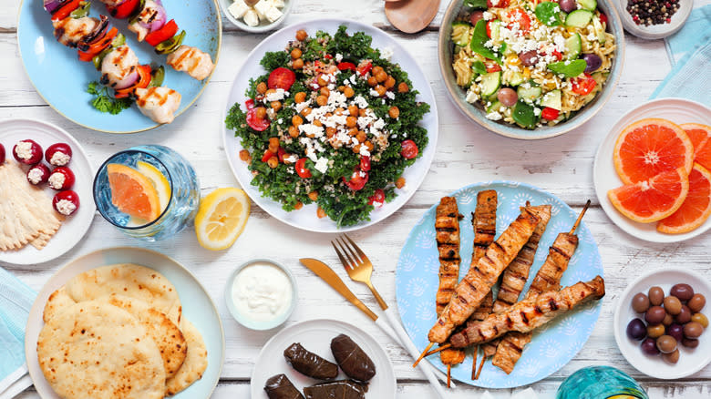 table filled with various Mediterranean dishes