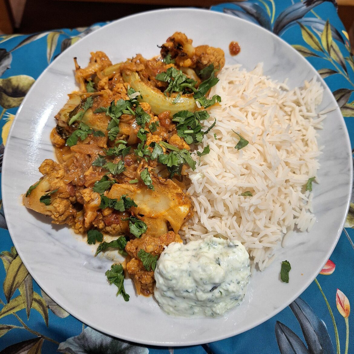 Cauliflower tikka masala with basmati rice and raita