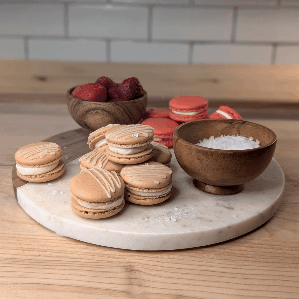 I made a batch of salted maple, and a batch of strawberry macarons for my wife's students today.  I just got a new phone so I tried to take some 'glamor shots' of them.