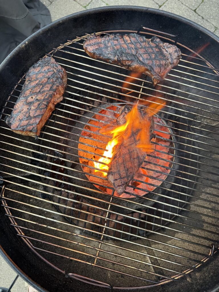 First steaks on the kettle over lump. A bit over but still so good.