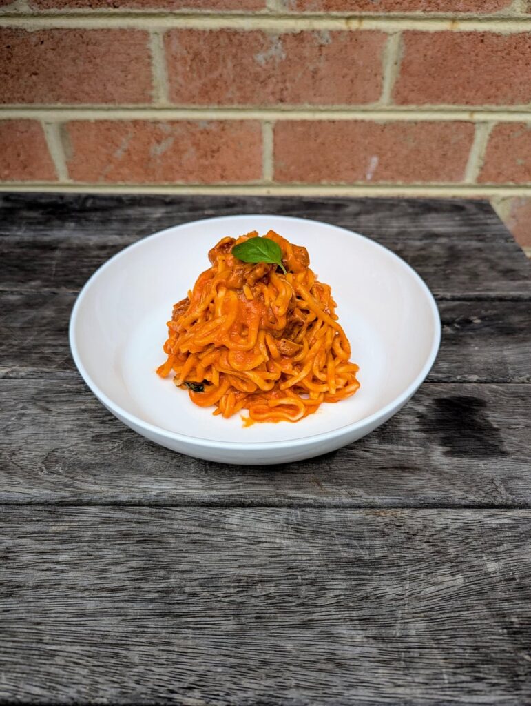Home-made Spaghetti alla chitarra with San Marzano tomato, cherry tomato and guanciale. Home-made Spaghetti alla chitarra with San Marzano tomato, cherry tomato and guanciale.