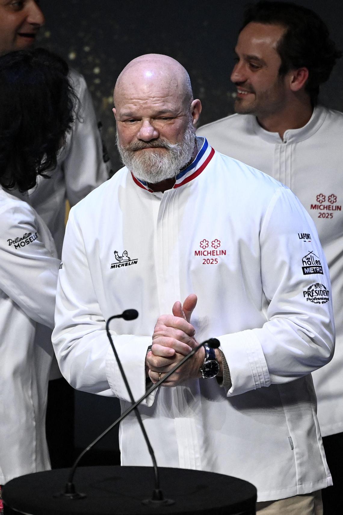 French chef at "Maison Nouvelle" restaurant in Bordeaux, Philippe Etchebest (C) speaks after he was awarded with two Michelin stars during the Michelin Guide for France 2025 awards ceremony in Metz, eastern France on March 31, 2025. (Photo by Jean-Christophe VERHAEGEN / AFP)
