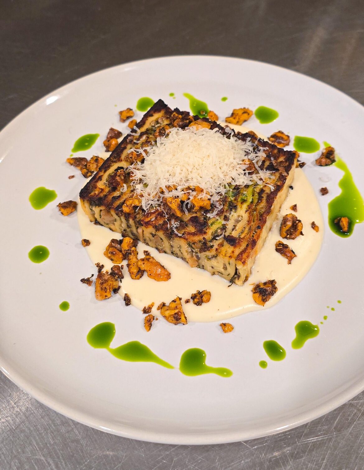 Foraged ramps / mushrooms / 4 cheese lasagna, parmesan cream, toasted spiced walnuts, ramp oil