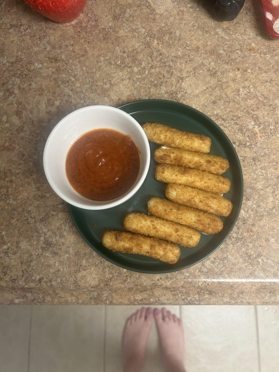 Freezer burned frozen mozzarella sticks with red sauce that's been in the fridge for like a week