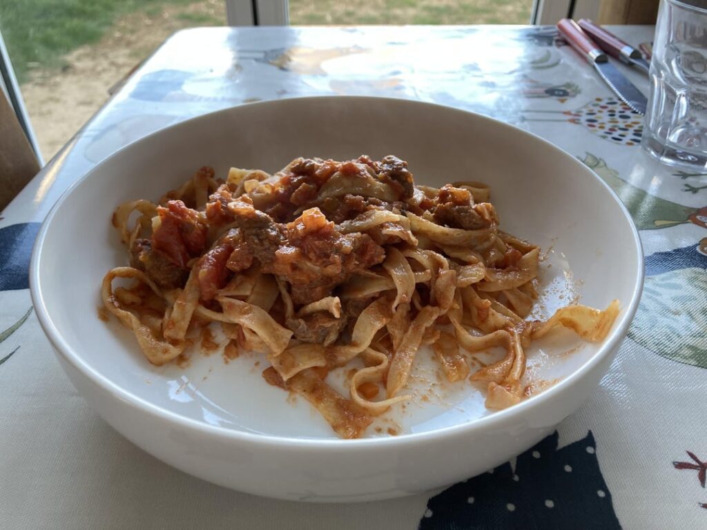 Bolognese and an attempt at tagliatelle. From scratch. Ugly, but it tasted good and I'm (17f) proud.