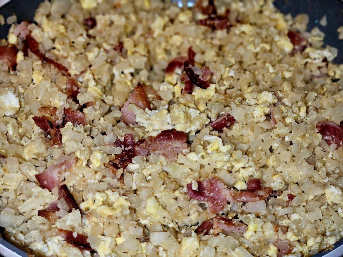 Fried cauliflower rice with bacon and eggs.
