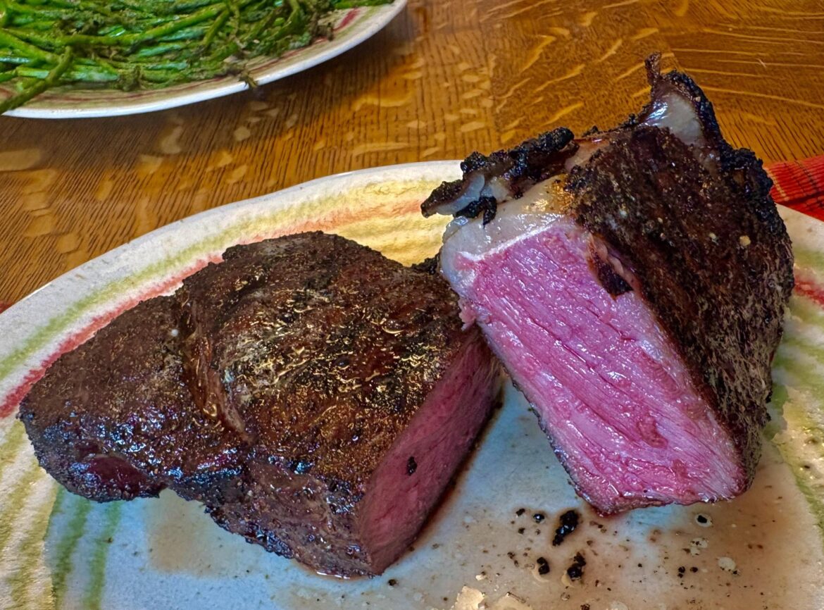 22oz Strip reverse seared and finished on coal grill