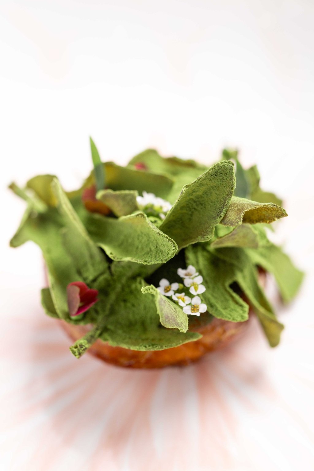 Camus artichoke roasted and glaze with saké Figs leaves and LongJing beurre blanc. Photo: Cristal Room by Anne-Sophie Pic Camus artichoke roasted and glaze with saké Figs leaves and LongJing beurre blanc. Photo: Cristal Room by Anne-Sophie Pic