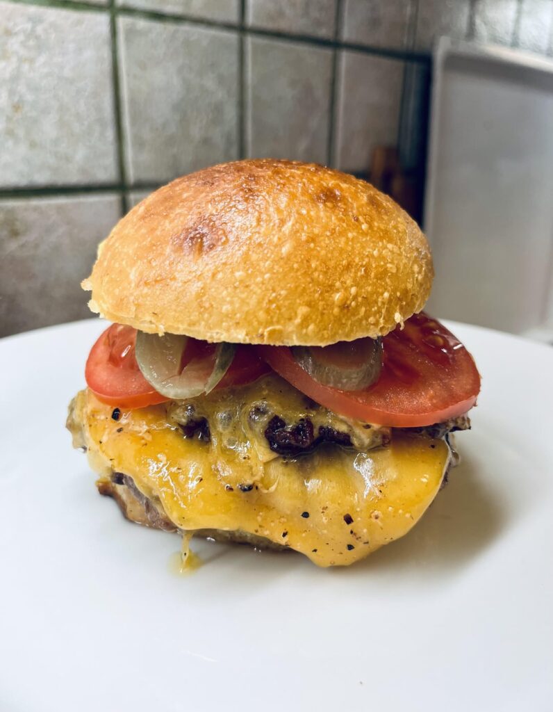 A double cheeseburger with pineapple flavoured sourdough buns | THE FAT CHAMOIS