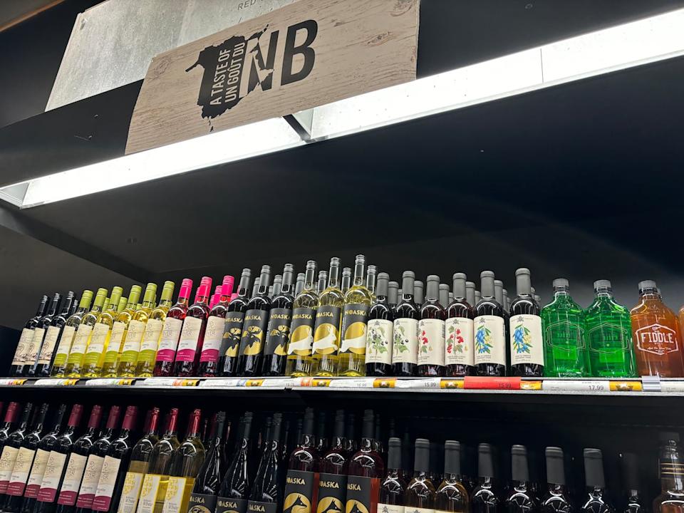 At the front of a Fredericton N.B. Liquor store, there's a display of New Brunswick wines and other products. 