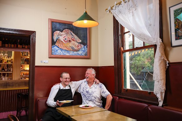Head chef Wesley Cooper-Jones and former head chef Martial Cosyn at Chez Crix, beneath an oil painting by Cosyn.