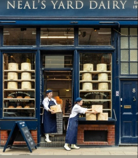 a poster for neal 's yard dairy shows two workers